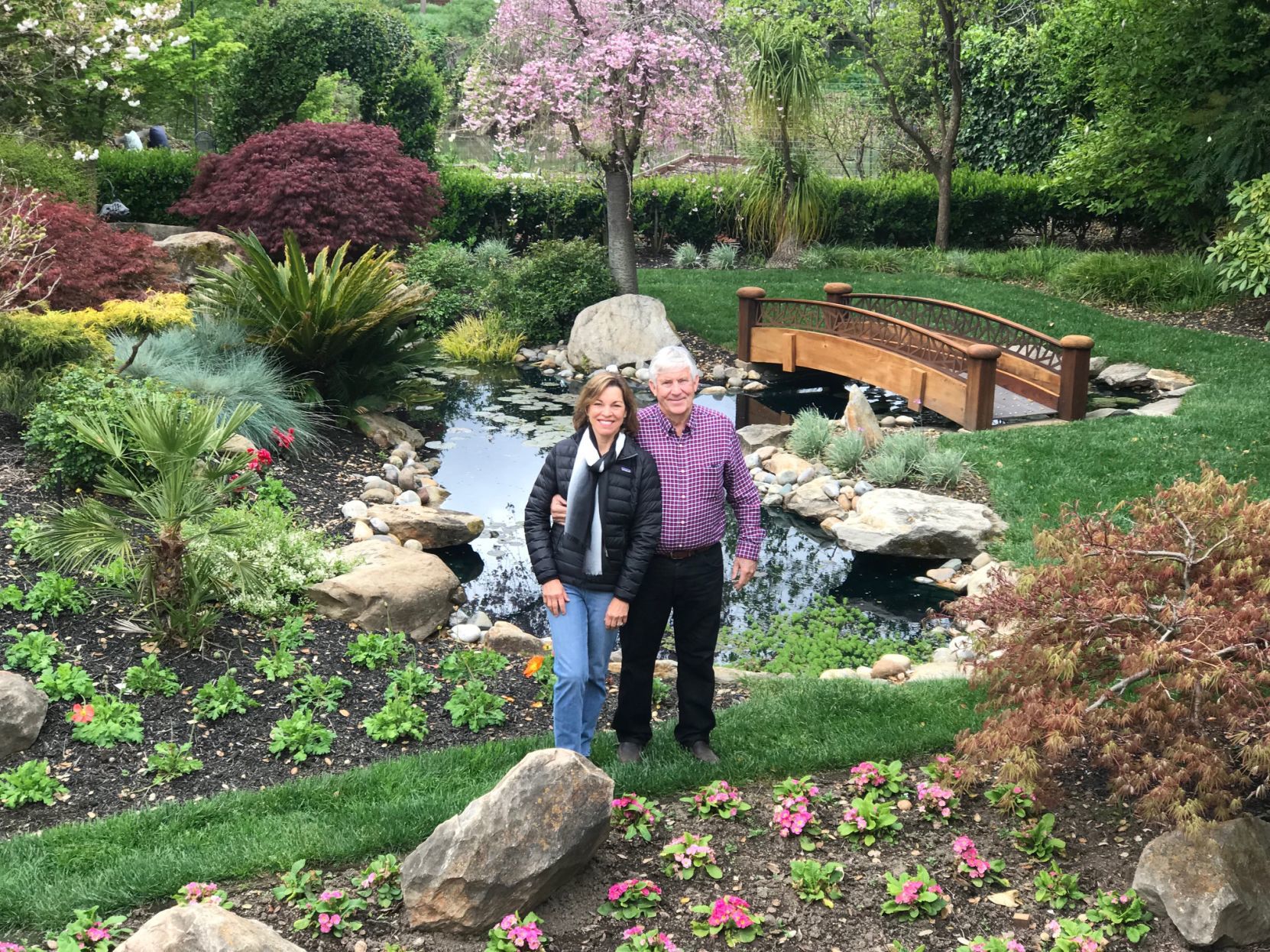 Maureen Dolan and Jon Huttinger as seen in the elaborate backyard garden of 1105 Juarez St.